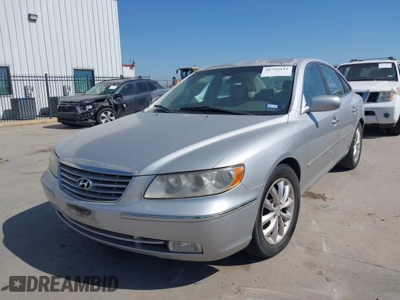 2006 Hyundai Azera SE with VIN KMHFC46FX6A107141, listed as a IAAI auction lot 41793111 with 124,137 mi miles and . Bid and sale history available at DreamBid. Image 2.