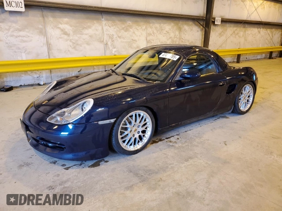 1999 Porsche Boxster z VIN WP0CA2983XU630435, wystawiony jako Copart lot #47402785 z przebiegiem 62 180 mil mil oraz Szkoda całkowita • Salvage title. Historia ofert i sprzedaży dostępna na DreamBid. Obrazek 1.