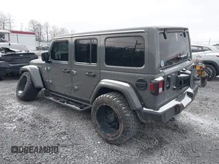 2019 Jeep Wrangler Unlimited Sahara with VIN 1C4HJXEG8KW533339, listed as a IAAI auction lot 40963653 with 69,202 mi miles and . Bid and sale history available at DreamBid. Image 3.