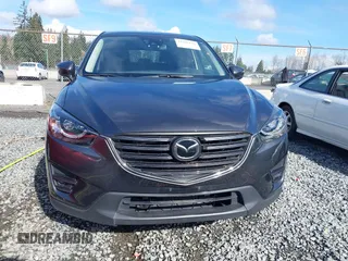 2016 Mazda CX-5 Grand Touring with VIN JM3KE4DY9G0895006, listed as a IAAI auction lot 41703146 with 39,359 mi miles. Bid and sale history available at carsss.com. Image 12.