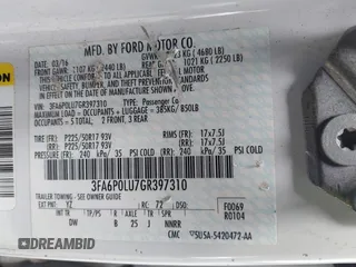 2016 Ford Fusion SE Hybrid with VIN 3FA6P0LU7GR397310, listed as a IAAI auction lot 42075891 with 124,879 mi miles. Bid and sale history available at carsss.com. Image 9.
