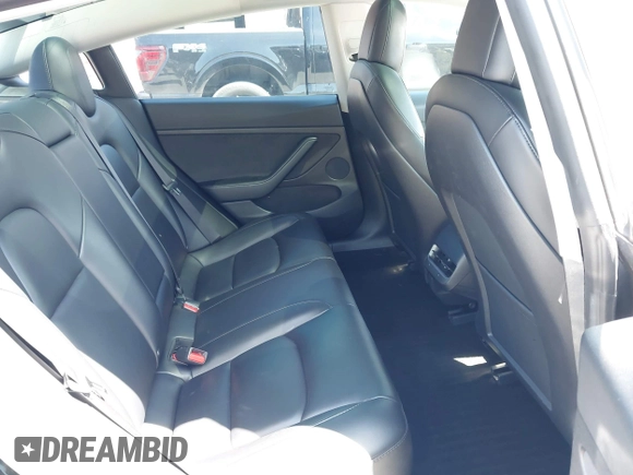 2021 Tesla Model 3 Long Range with VIN 5YJ3E1EB4MF064631, listed as a IAAI auction lot 41424856 with 95,511 mi miles and . Bid and sale history available at DreamBid. Image 8.