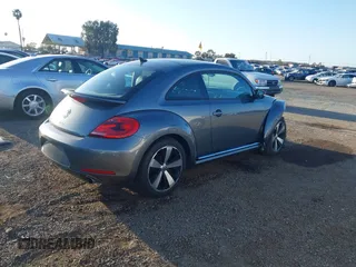 2012 Volkswagen Beetle 2.0T Turbo w/Sun/Snd/Nav PZEV with VIN 3VWVA7AT4CM628968, listed as a IAAI auction lot 41847614 with 71,813 mi miles. Bid and sale history available at carsss.com. Image 4.