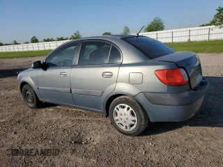 2007 Kia Rio LX with VIN KNADE123X76253489, listed as a Copart auction lot 52176475 with 148,154 mi miles and Salvage Title. Bid and sale history available at carsss.com. Image 2.