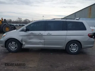 2006 Honda Odyssey EX-L z VIN 5FNRL38766B018014, wystawiony jako IAAI lot #41497144 z przebiegiem 230 225 mil mil oraz . Historia ofert i sprzedaży dostępna na DreamBid. Obrazek 14.