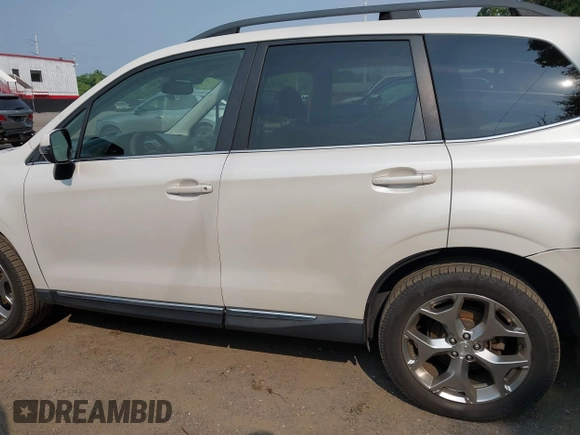 2015 Subaru Forester Touring with VIN JF2SJAWC9FH573973, listed as a IAAI auction lot 42380080 with 87,938 mi miles and . Bid and sale history available at DreamBid. Image 14.