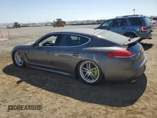 2014 Porsche Panamera S E-Hybrid z VIN WP0AD2A78EL044818, wystawiony jako Copart lot #65864484 z przebiegiem 141 423 mil mil oraz Szkoda całkowita • Salvage title. Historia ofert i sprzedaży dostępna na DreamBid. Obrazek 2.