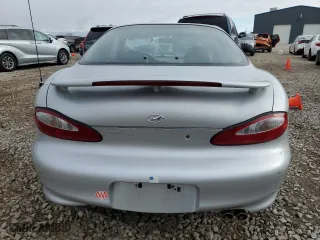 1999 Hyundai Tiburon with VIN KMHJG24F8XU126762, listed as a Copart auction lot 88747725 with 51,296 mi miles and Salvage Title. Bid and sale history available at carsss.com. Image 6.