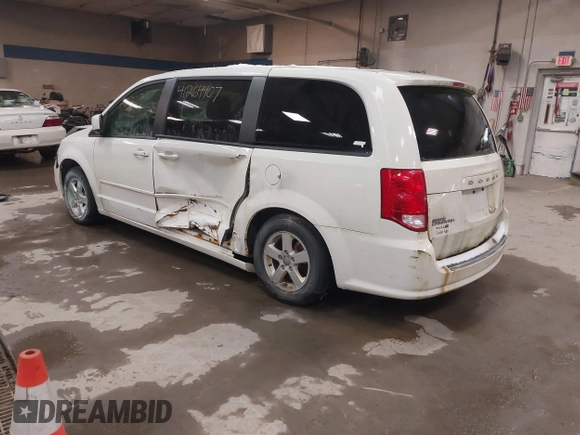 2012 Dodge Grand Caravan SXT with VIN 2C4RDGCG3CR405373, listed as a IAAI auction lot 41264407 with 164,019 mi miles and . Bid and sale history available at DreamBid. Image 3.