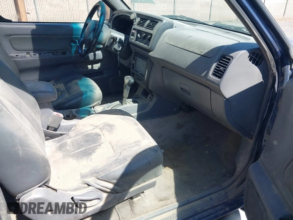 2000 Nissan Frontier XE with VIN 1N6ED27TXYC378601, listed as a IAAI auction lot 42690648 with 216,829 mi miles and . Bid and sale history available at DreamBid. Image 5.