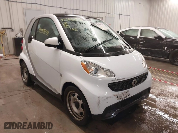 2015 Smart fortwo Passion z VIN WMEEJ3BA2FK790569, wystawiony jako IAAI lot #41598759 z przebiegiem 78 307 mil mil oraz . Historia ofert i sprzedaży dostępna na DreamBid. Obrazek 1.