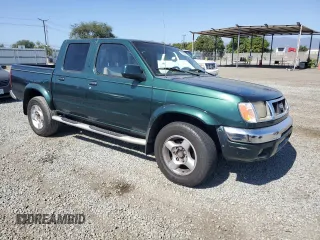 2000 Nissan Frontier XE with VIN 1N6ED27T0YC364061, listed as a Copart auction lot 61863515 with 226,867 mi miles and Clean title. Bid and sale history available at DreamBid. Image 4.