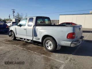 2000 Ford F-150 XL with VIN 1FTZX0723YKA02769, listed as a Copart auction lot 78722714 with 354,312 mi miles and Salvage title. Bid and sale history available at DreamBid. Image 2.