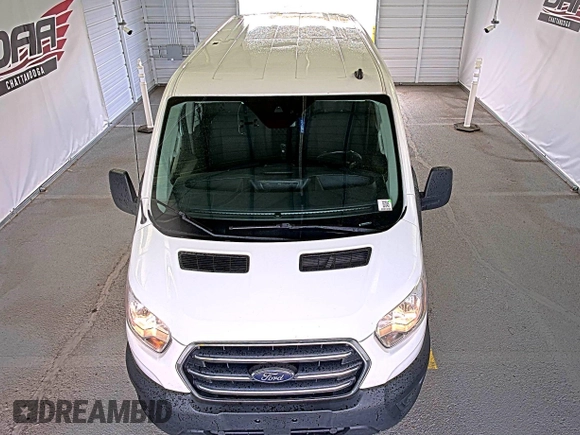 2020 Ford Transit Cargo z VIN 1FTBR1Y89LKA77943, wystawiony jako IAAI lot #42642576 z przebiegiem 144 064 mil mil oraz . Historia ofert i sprzedaży dostępna na DreamBid. Obrazek 8.
