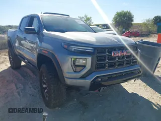 2024 GMC Canyon 4WD AT4X with VIN 1GTP6EEK6R1250127, listed as a IAAI auction lot 41823196 with 1,574 mi miles and . Bid and sale history available at carsss.com. Image 1.