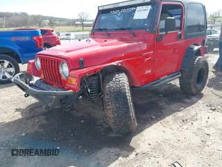 2002 Jeep Wrangler Sport with VIN 1J4FA49S42P771262, listed as a IAAI auction lot 41819403 with 132,871 mi miles. Bid and sale history available at carsss.com. Image 6.
