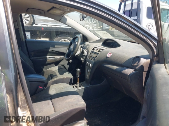 2009 Toyota Yaris with VIN JTDBT903891349784, listed as a IAAI auction lot 42135557 with 244,107 mi miles. Bid and sale history available at carsss.com. Image 5.