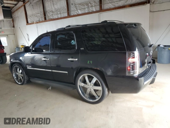 2010 Chevrolet Tahoe LTZ with VIN 1GNUKCE05AR236038, listed as a Copart auction lot 63033425 with 132,236 mi miles and Salvage title. Bid and sale history available at DreamBid. Image 2.