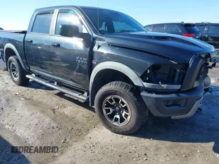 2017 Ram 1500 Rebel z VIN 1C6RR6YTXHS505419, wystawiony jako IAAI lot #41351373 z przebiegiem 117 987 mil mil oraz . Historia ofert i sprzedaży dostępna na DreamBid. Obrazek 1.
