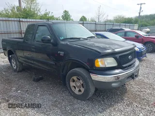 2003 Ford F-150 XL with VIN 2FTRX18W73CA80587, listed as a IAAI auction lot 42119924 with 222,990 mi miles. Bid and sale history available at carsss.com. Image 1.