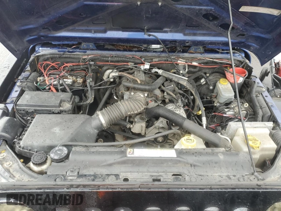 2009 Jeep Wrangler X with VIN 1J4FA24179L700884, listed as a Copart auction lot 52194055 with 96,189 mi miles and Salvage Title. Bid and sale history available at DreamBid. Image 12.