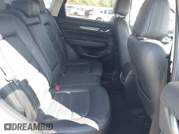 2021 Mazda CX-5 Grand Touring with VIN JM3KFBDM3M1300316, listed as a IAAI auction lot 41878520 with 77,670 mi miles and . Bid and sale history available at DreamBid. Image 8.