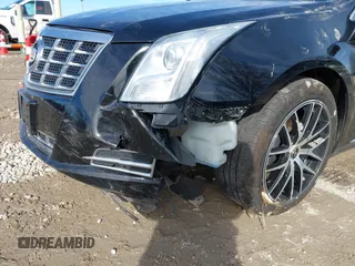 2015 Cadillac XTS Luxury z VIN 2G61N5S35F9155543, wystawiony jako IAAI lot #41699914 z przebiegiem 120 700 mil mil oraz . Historia ofert i sprzedaży dostępna na DreamBid. Obrazek 6.