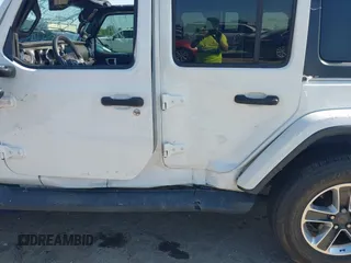 2019 Jeep Wrangler Unlimited Sahara with VIN 1C4HJXEG0KW577917, listed as a IAAI auction lot 41993670 with 90,584 mi miles and . Bid and sale history available at DreamBid. Image 6.