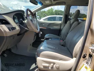 2014 Toyota Sienna XLE with VIN 5TDYK3DC8ES414814, listed as a Copart auction lot 64577875 with 111,675 mi miles and Salvage title. Bid and sale history available at DreamBid. Image 7.