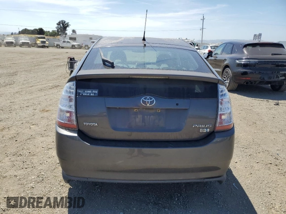 2007 Toyota Prius z VIN JTDKB20U473211597, wystawiony jako Copart lot #58437915 z przebiegiem 252 737 mil mil oraz Szkoda całkowita • Salvage title. Historia ofert i sprzedaży dostępna na DreamBid. Obrazek 6.