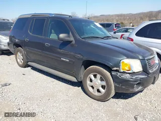 2004 GMC Envoy SLE with VIN 1GKDS13S242370041, listed as a IAAI auction lot 41698413 with 158,160 mi miles. Bid and sale history available at carsss.com. Image 1.