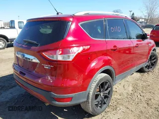 2016 Ford Escape Titanium with VIN 1FMCU9J98GUB42453, listed as a IAAI auction lot 41760110 with 116,452 mi miles. Bid and sale history available at carsss.com. Image 4.