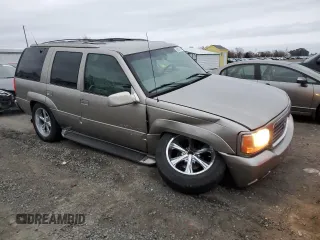 2000 Cadillac Escalade z VIN 1GYEK63R5YR219759, wystawiony jako Copart lot #86373734 z przebiegiem 190 307 mil mil oraz Szkoda całkowita • Salvage title. Historia ofert i sprzedaży dostępna na DreamBid. Obrazek 4.