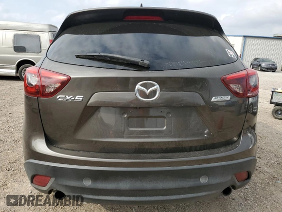 2016 Mazda CX-5 Grand Touring z VIN JM3KE2DY7G0735355, wystawiony jako Copart lot #49438285 z przebiegiem 132 731 mil mil oraz Szkoda całkowita • Salvage title. Historia ofert i sprzedaży dostępna na DreamBid. Obrazek 6.