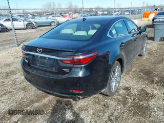 2021 Mazda 6 Signature with VIN JM1GL1XY7M1615149, listed as a IAAI auction lot 41851158 with 47,690 mi miles and . Bid and sale history available at DreamBid. Image 4.
