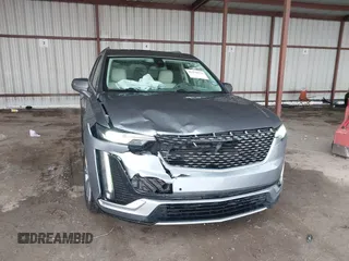 2022 Cadillac XT6 Premium Luxury z VIN 1GYKPDRS1NZ108012, wystawiony jako IAAI lot #41178333 z przebiegiem 83 987 mil mil oraz . Historia ofert i sprzedaży dostępna na DreamBid. Obrazek 6.