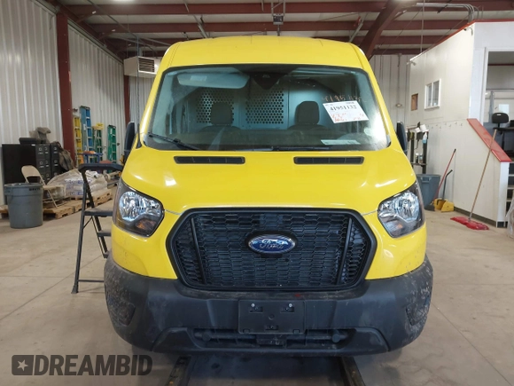2023 Ford Transit Cargo with VIN 1FTBR2C88PKB17299, listed as a IAAI auction lot 41951132 with 19,461 mi miles and . Bid and sale history available at DreamBid. Image 12.
