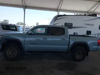 2022 Toyota Tacoma SR with VIN 3TMCZ5ANXNM479025, listed as a IAAI auction lot 42280363 with 29,650 mi miles and . Bid and sale history available at DreamBid. Image 14.