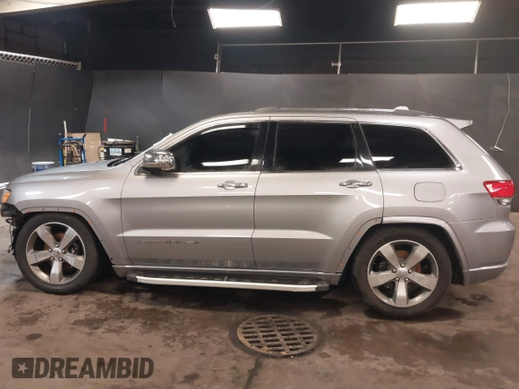 2015 Jeep Grand Cherokee Overland with VIN 1C4RJFCG1FC215426, listed as a IAAI auction lot 41689821 with 128,563 mi miles. Bid and sale history available at carsss.com. Image 15.