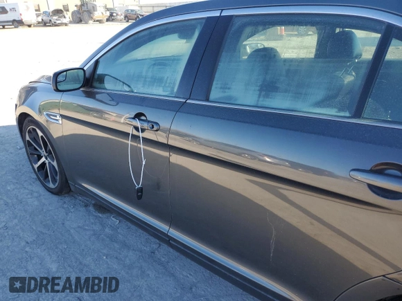 2015 Ford Taurus SEL with VIN 1FAHP2E99FG193966, listed as a Copart auction lot 82333044 with Not Provided miles and Salvage Title. Bid and sale history available at DreamBid. Image 7.