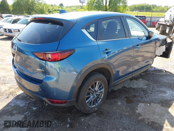 2020 Mazda CX-5 Touring z VIN JM3KFBCM2L0848233, wystawiony jako IAAI lot #42189719 z przebiegiem 80 893 mil mil oraz . Historia ofert i sprzedaży dostępna na DreamBid. Obrazek 4.