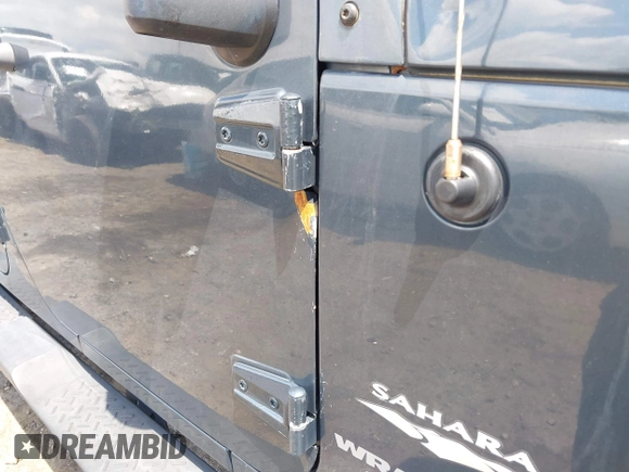 2007 Jeep Wrangler Unlimited Sahara with VIN 1J4GA59117L216687, listed as a IAAI auction lot 42188257 with 176,507 mi miles and . Bid and sale history available at DreamBid. Image 18.