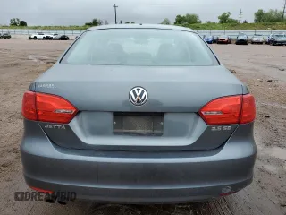 2012 Volkswagen Jetta SE z VIN 3VWDX7AJ7CM124472, wystawiony jako Copart lot #58871595 z przebiegiem 143 563 mil mil oraz Czysty tytuł • Clean title. Historia ofert i sprzedaży dostępna na DreamBid. Obrazek 6.