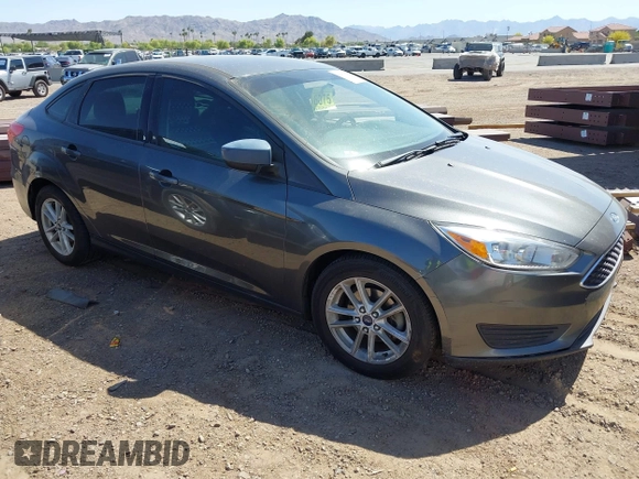 2018 Ford Focus SE with VIN 1FADP3FE6JL270910, listed as a IAAI auction lot 42130371 with 121,240 mi miles. Bid and sale history available at carsss.com. Image 1.