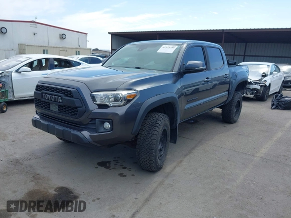 2019 Toyota Tacoma SR with VIN 3TMCZ5AN3KM207783, listed as a IAAI auction lot 42375280 with 55,784 mi miles and . Bid and sale history available at DreamBid. Image 18.