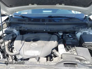 2020 Mazda CX-9 Sport with VIN JM3TCABY1L0406720, listed as a IAAI auction lot 42304144 with 75,887 mi miles and . Bid and sale history available at DreamBid. Image 10.