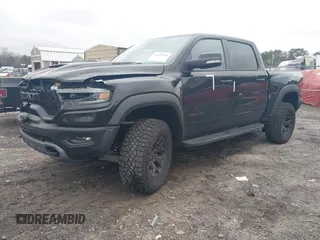 2022 Ram 1500 TRX with VIN 1C6SRFU9XNN476106, listed as a IAAI auction lot 41627895 with 21,992 mi miles and . Bid and sale history available at DreamBid. Image 2.