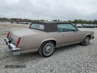 1985 Cadillac Eldorado z VIN 1G6EL5788FE655155, wystawiony jako Copart lot #73223134 z przebiegiem 68 676 mil mil oraz Tytuł czysty. Historia ofert i sprzedaży dostępna na DreamBid. Obrazek 3.