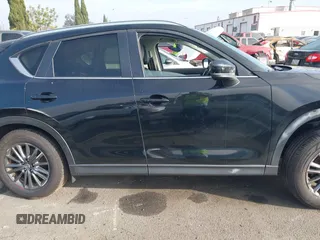 2021 Mazda CX-5 Touring with VIN JM3KFACM2M0339349, listed as a IAAI auction lot 41651005 with 53,792 mi miles. Bid and sale history available at carsss.com. Image 13.