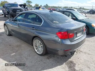 2013 BMW 3 Series 328i xDrive with VIN WBA3B3G56DNR81144, listed as a IAAI auction lot 40620694 with 159,022 mi miles. Bid and sale history available at carsss.com. Image 3.